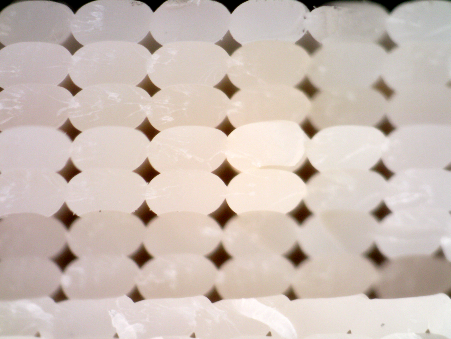 Cross-section showing void formation between extrusion lines in FDM infill